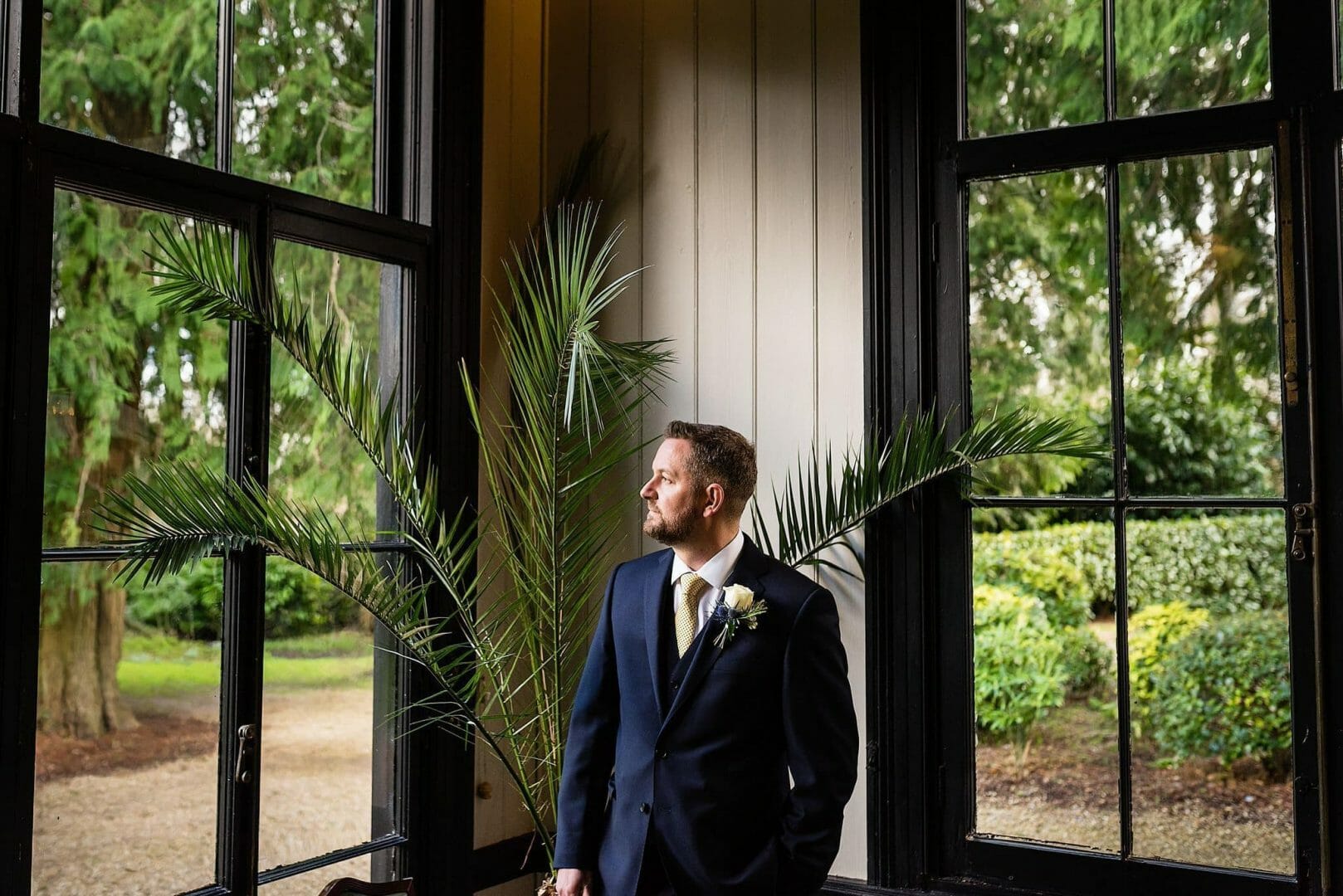 Larmertree garden wedding 26 Groom awaits the bride at Larmer tree Gardens