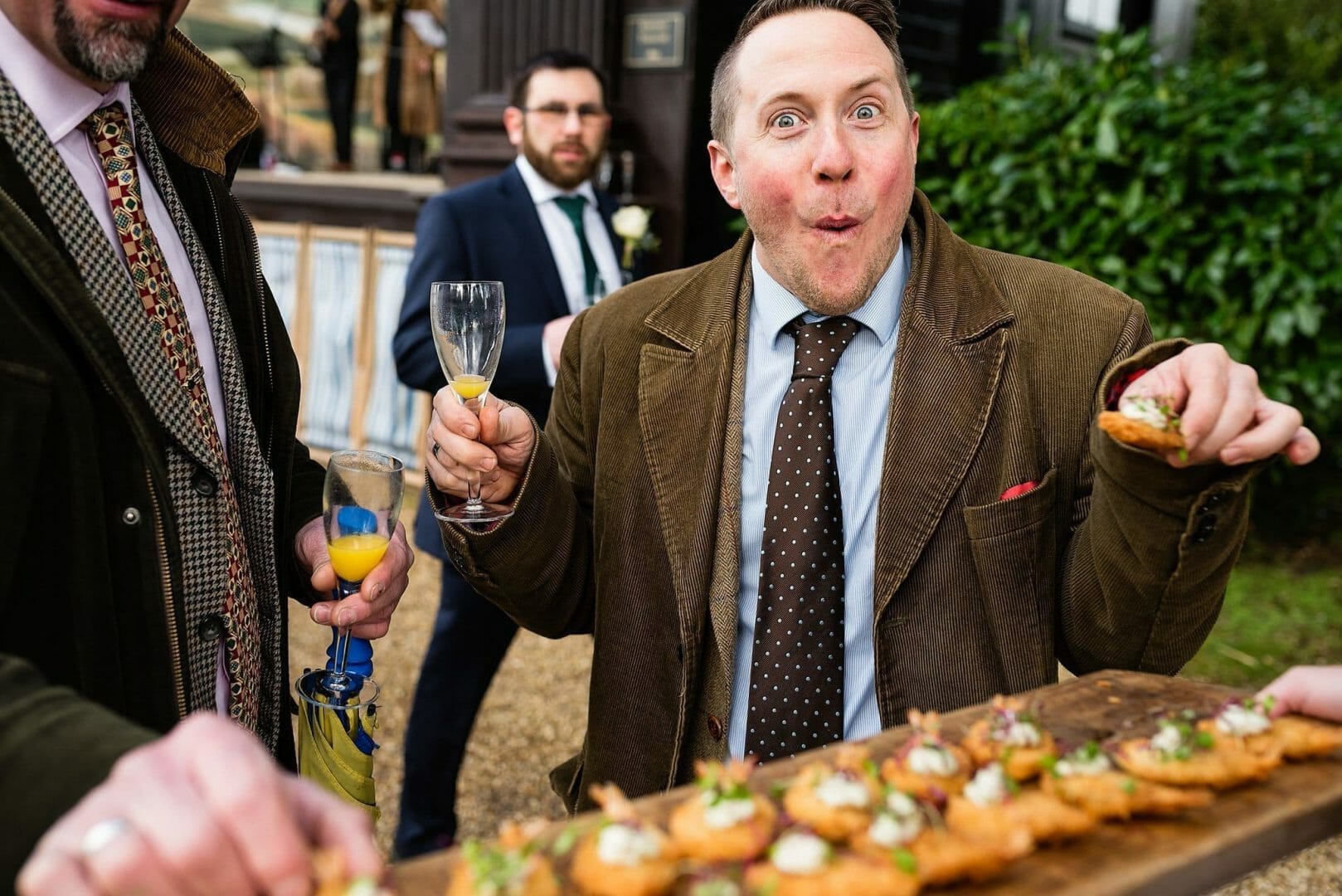 Larmertree garden wedding 86 Eating canapés at Larmer tree Gardens in Wiltshire