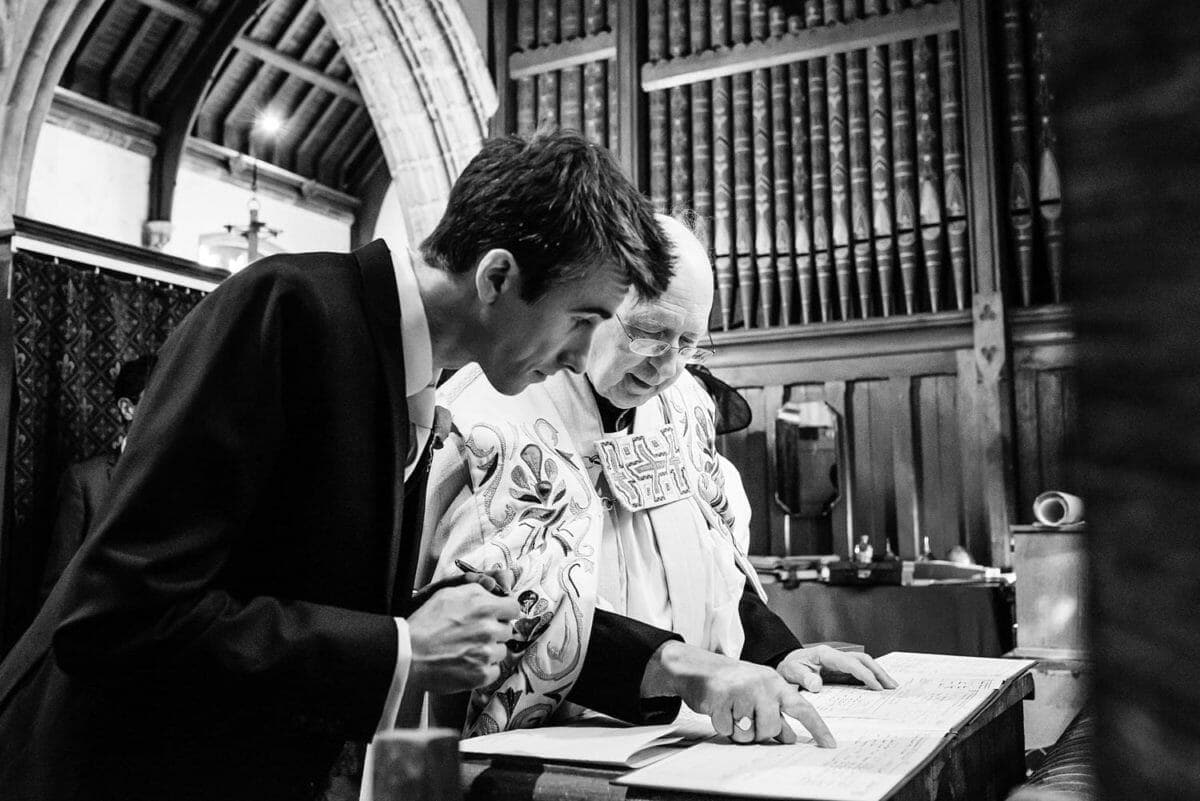 Signing the register with the Vicar