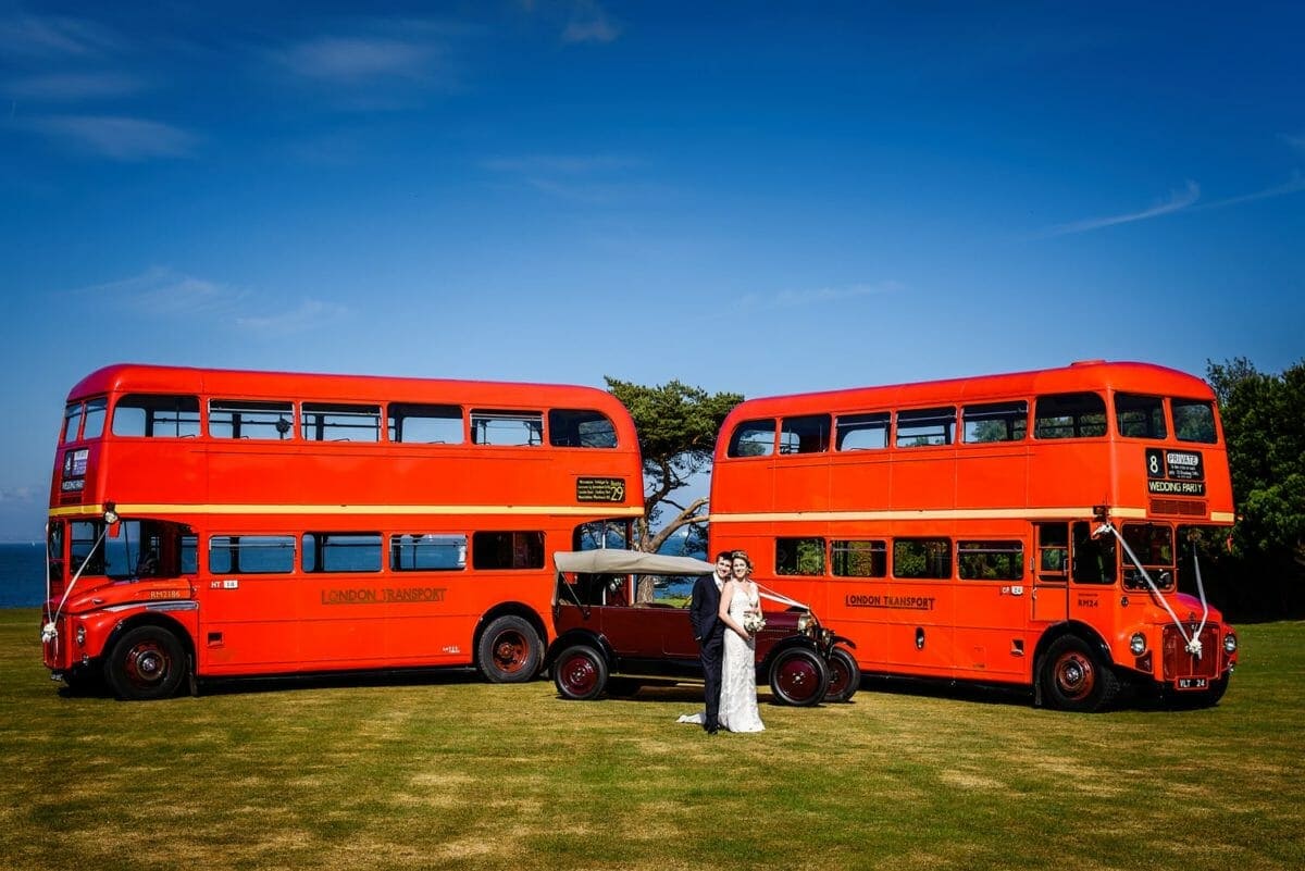 Routemaster buses at Studland bay house wedding
