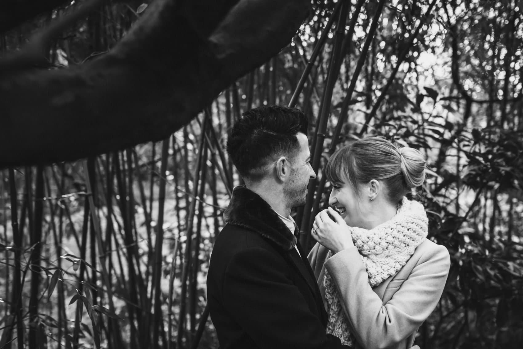 Groom makes bride laugh in the bamboo - Bournemouth gardens