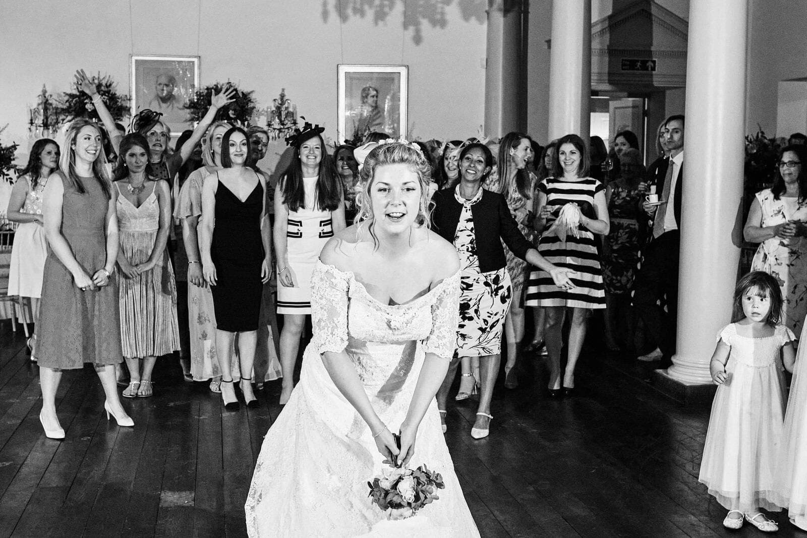 bride throws bouquet at North Cadbury Court Wedding