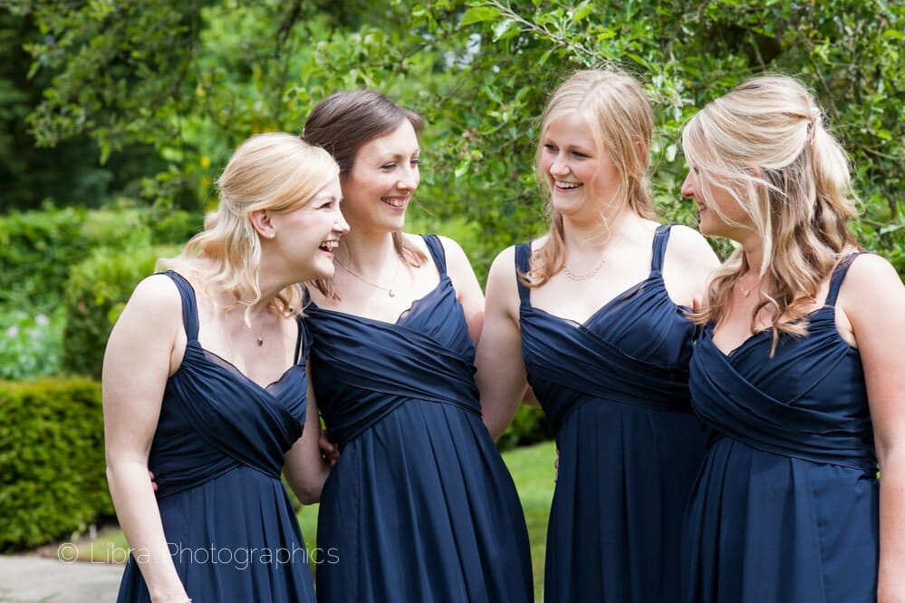 Bridemaids laughing at each other