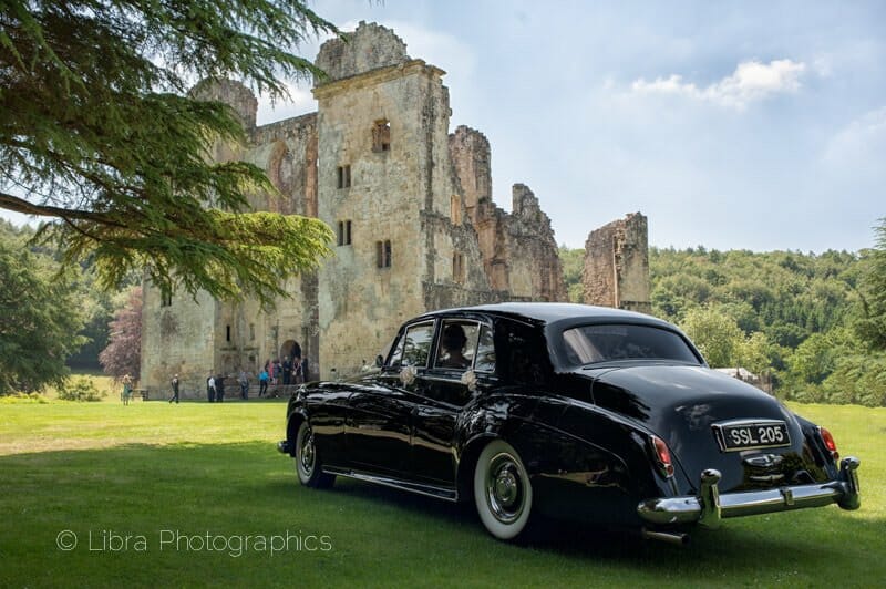 wedding car arriving at Old Wardour castle