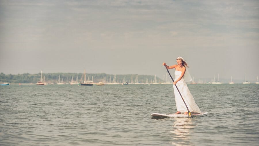 Bride takes a ride on a Paddle Board in her dress